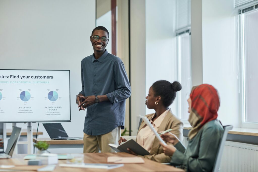 Entry-level marketing professional engaging customers during a direct marketing presentation.