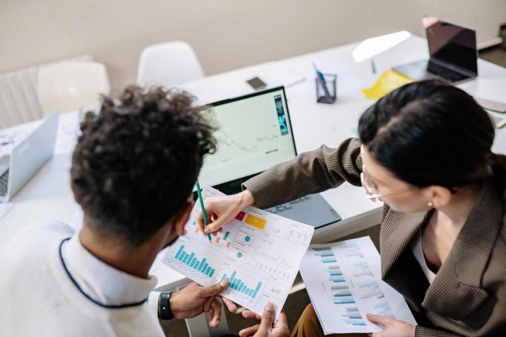 Marketing professionals analyzing campaign data and planning strategy in a collaborative workspace